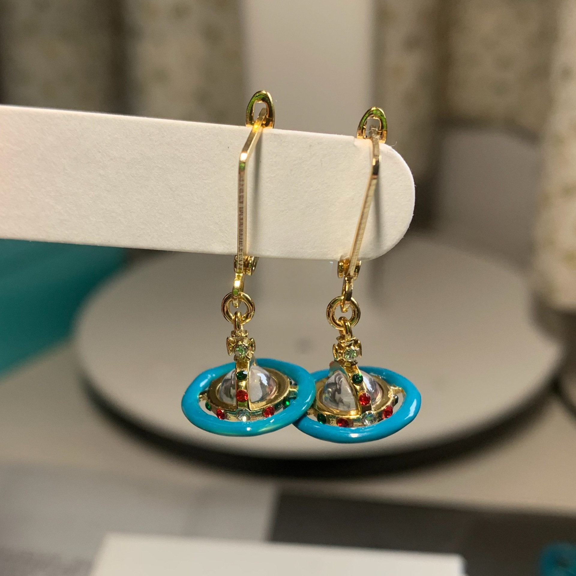 Buy replica Vivienne Westwood Enamel Pink Blue Black Saturn Earrings and replica jewelry from PICKS Jewelry