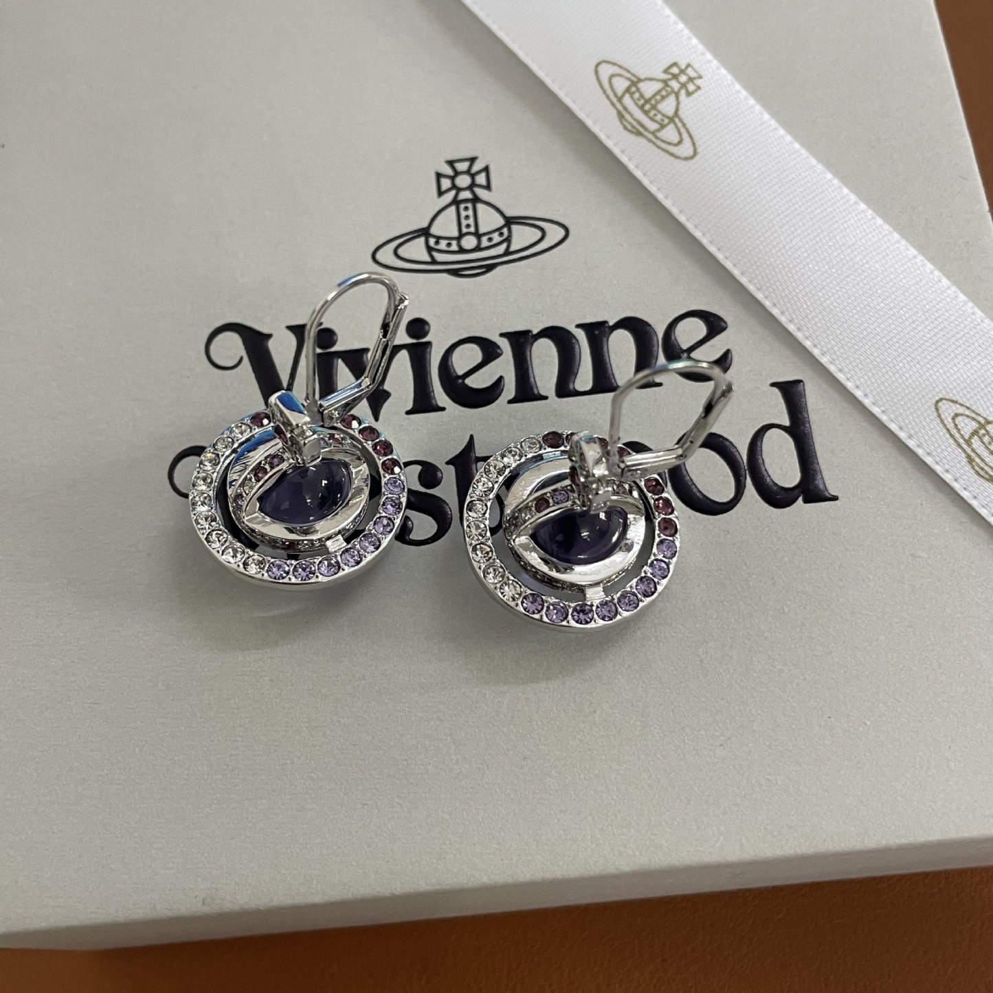 Buy replica Vivienne Westwood Light Purple Crystal Ball Planet Saturn Earrings and replica jewelry from PICKS Jewelry