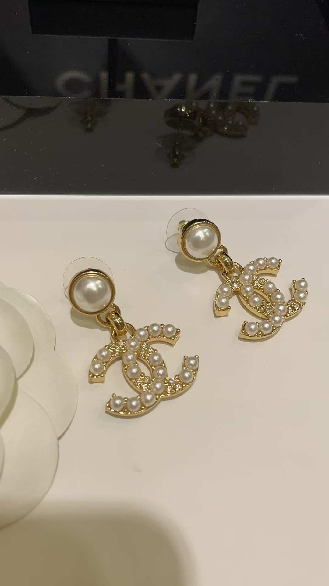 Buy replica Chanel Pearl Paved Double C Earrings and replica jewelry from PICKS Jewelry