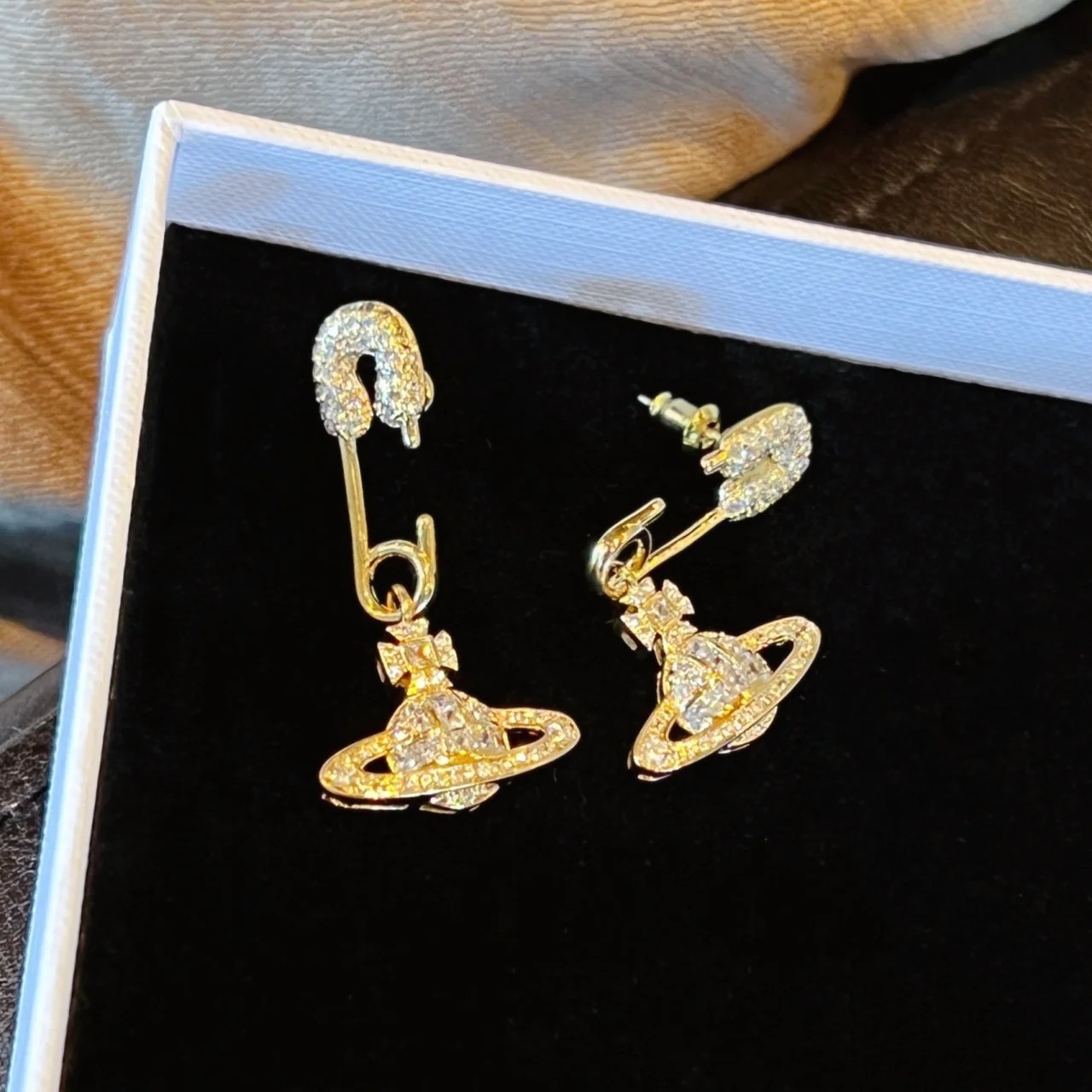 Buy replica Vivienne Westwood Diamond Inlay Paperclip Saturn Earrings and replica jewelry from PICKS Jewelry