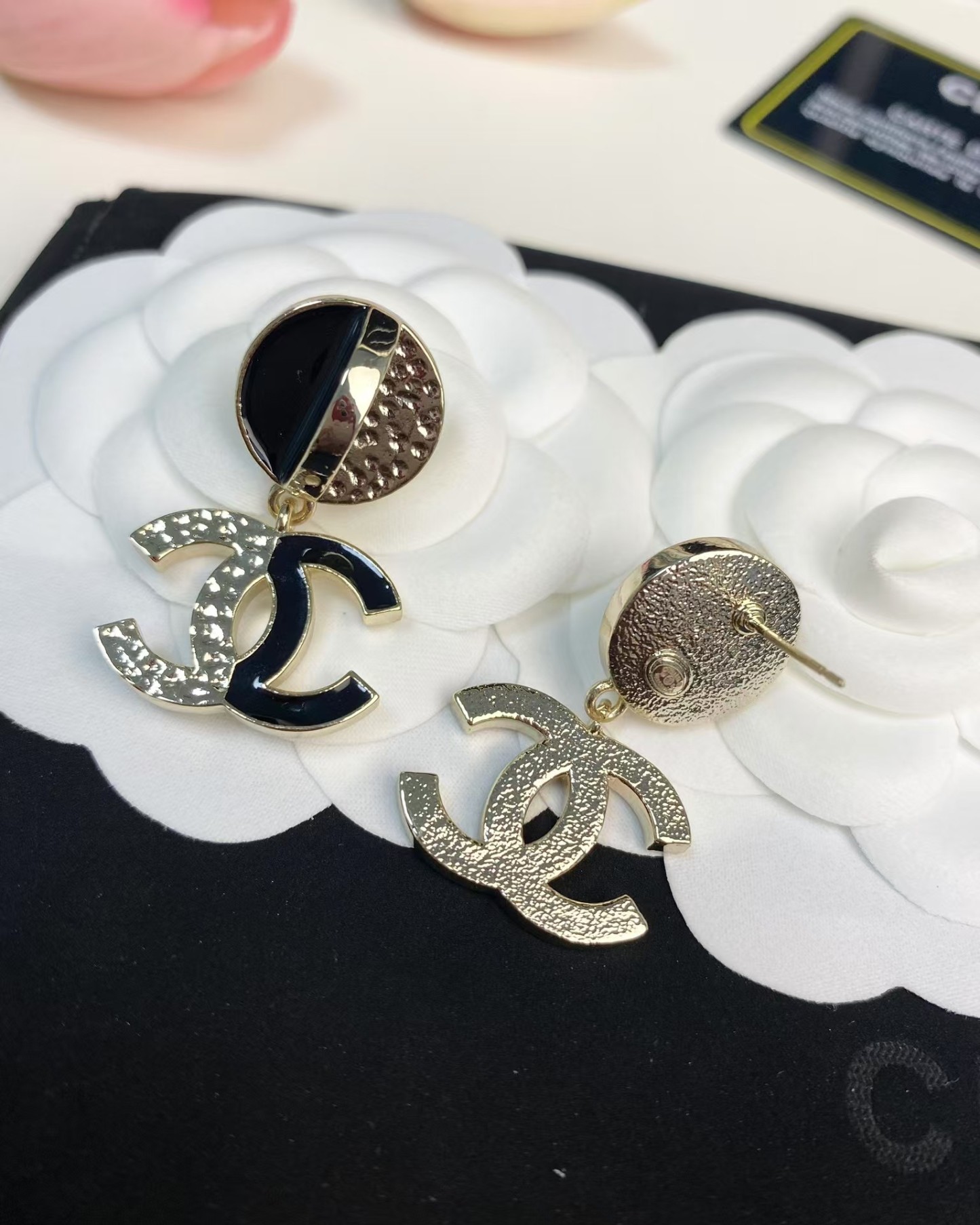 Buy replica Chanel Half Black Enamel Double C Dangle Earrings and replica jewelry from PICKS Jewelry