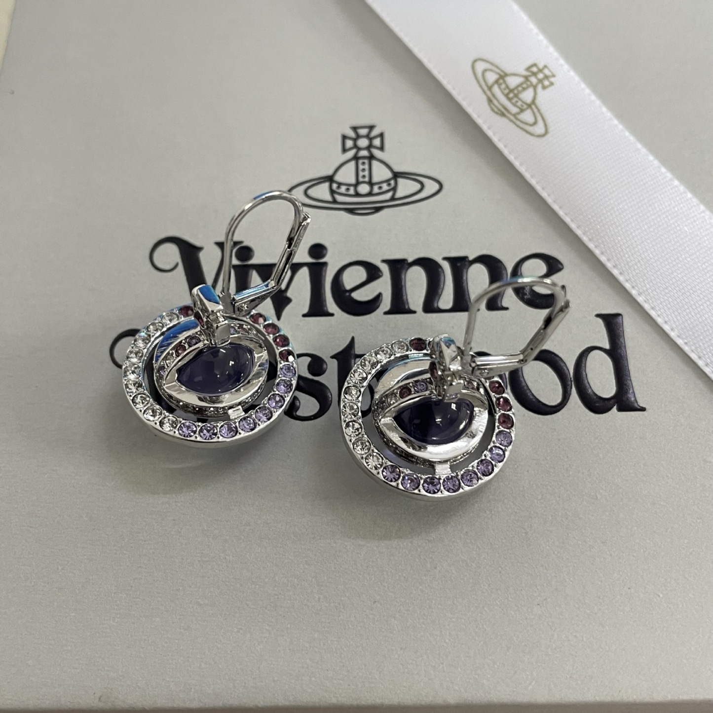 Buy replica Vivienne Westwood Light Purple Crystal Ball Planet Saturn Earrings and replica jewelry from PICKS Jewelry