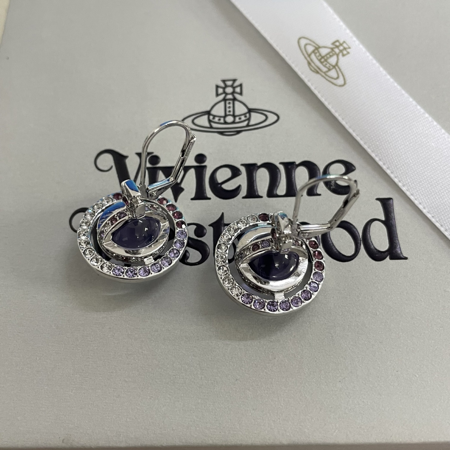 Buy replica Vivienne Westwood Light Purple Crystal Ball Planet Saturn Earrings and replica jewelry from PICKS Jewelry