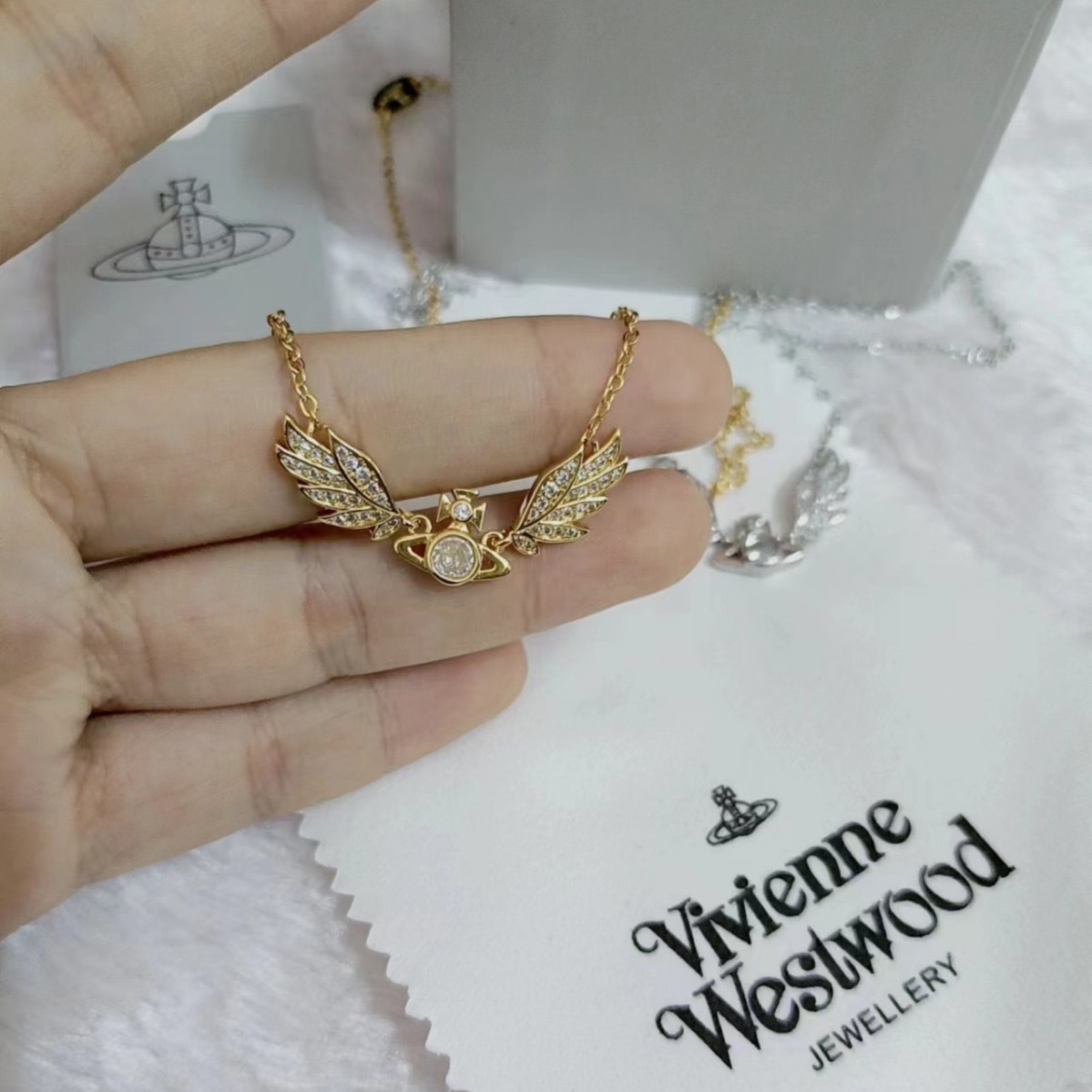 Buy replica Vivienne Westwood Angel Wing Saturn Earrings and replica jewelry from PICKS Jewelry