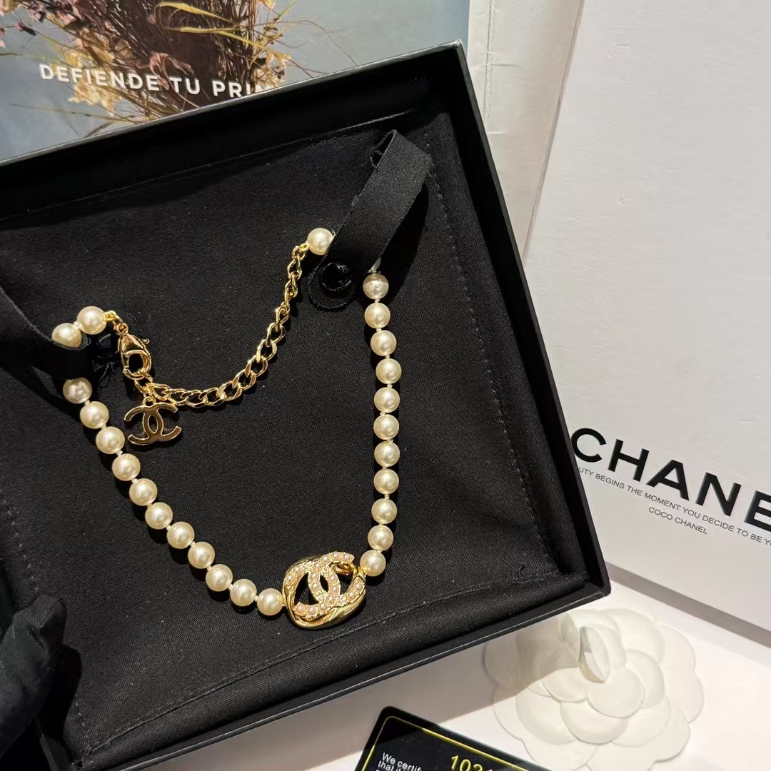 Buy replica Chanel Round Double C Pendant Pearl Choker Necklace and replica jewelry from PICKS Jewelry