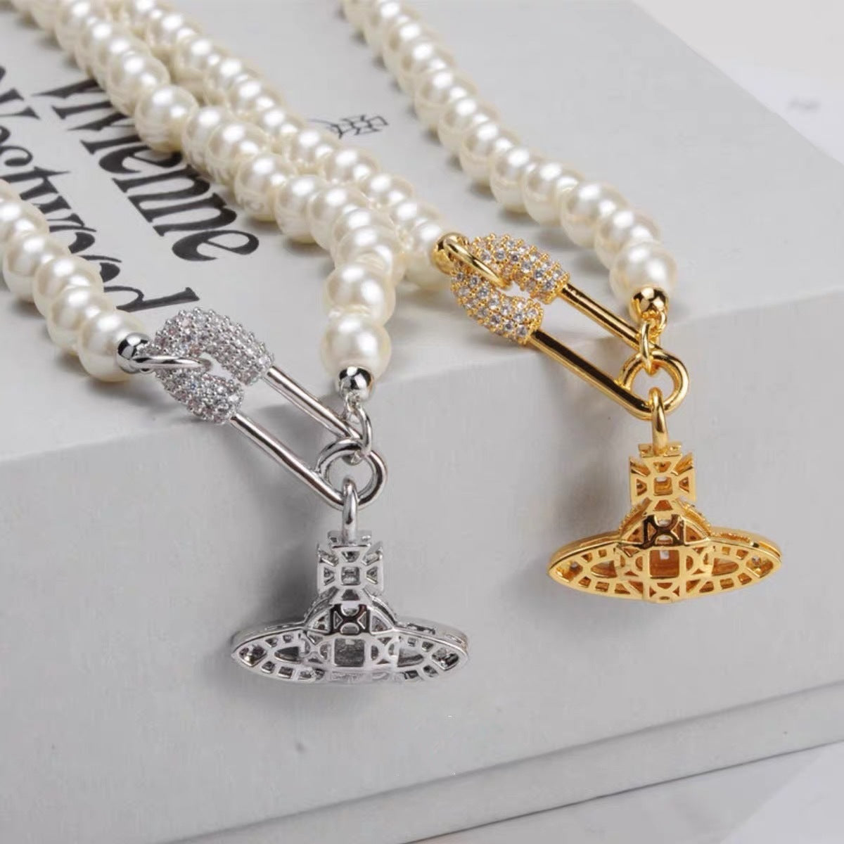 Buy replica Vivienne Westwood Paperclip Saturn Pearl Necklace and replica jewelry from PICKS Jewelry