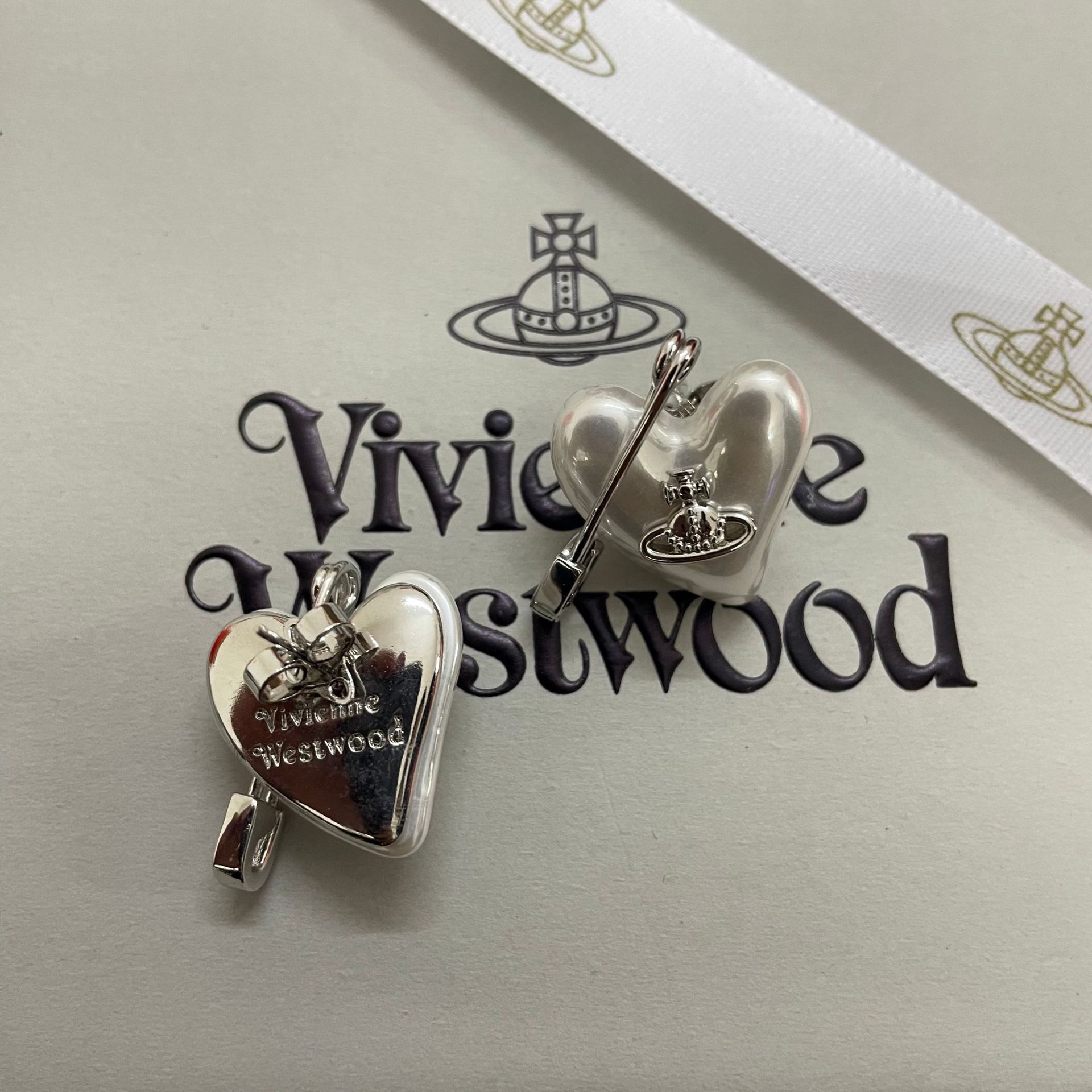 Buy replica Vivienne Westwood Heart Paperclip Saturn Stud Earrings and replica jewelry from PICKS Jewelry