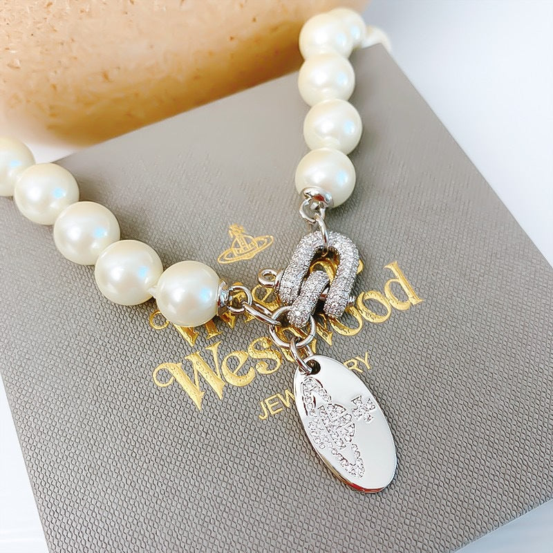 Buy replica Vivienne Westwood Horseshoe Clasp Saturn Pearl Necklace and replica jewelry from PICKS Jewelry