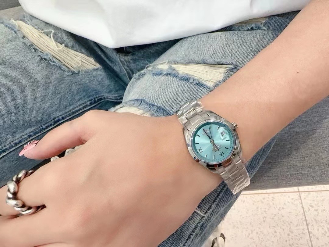 Buy replica Vivienne Westwood Light Blue Dial Silver Band Saturn Watch - 28MM and replica jewelry from PICKS Jewelry