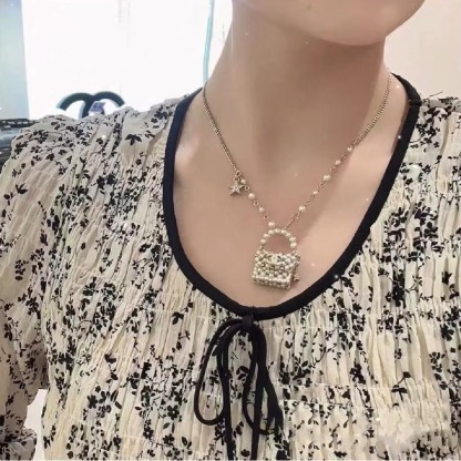 Buy replica Chanel Pearl Bag Pendant Necklace and replica jewelry from PICKS Jewelry