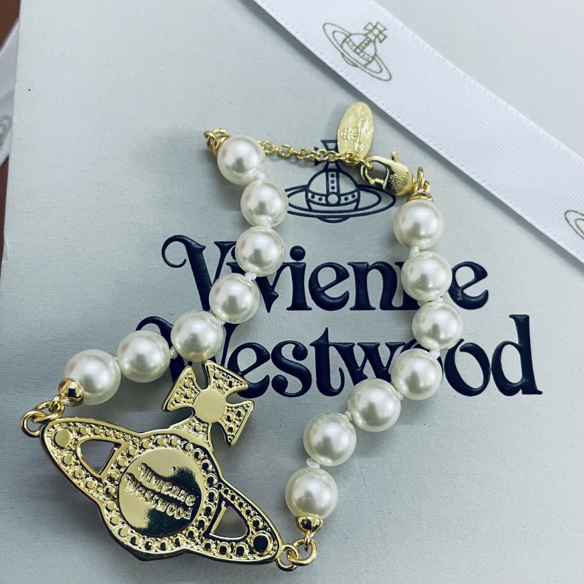 Buy replica Vivienne Westwood Enamel Diamond Saturn Bracelet and replica jewelry from PICKS Jewelry