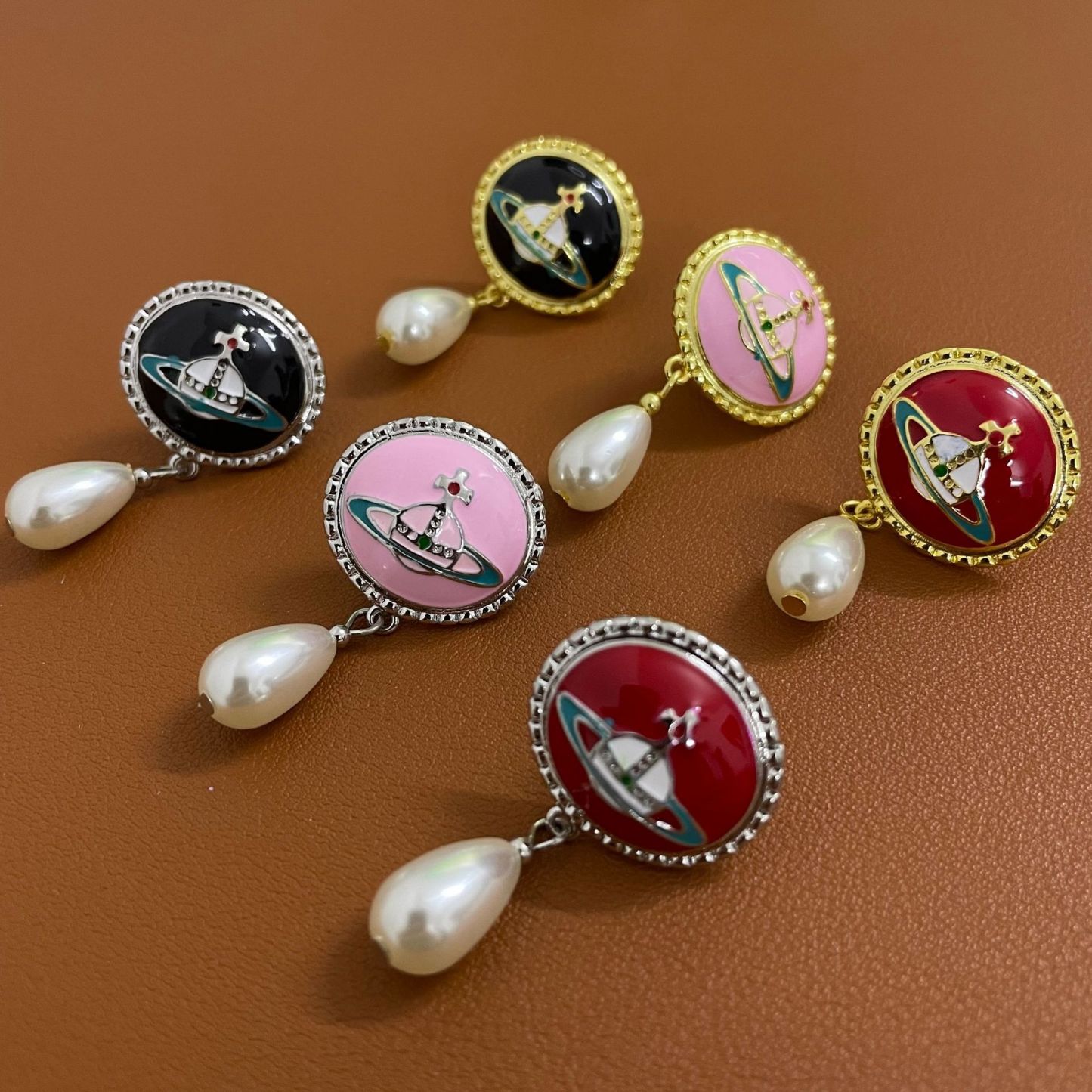 Buy replica Vivienne Westwood Enamel Saturn Waterdrop Pearl Earrings and replica jewelry from PICKS Jewelry