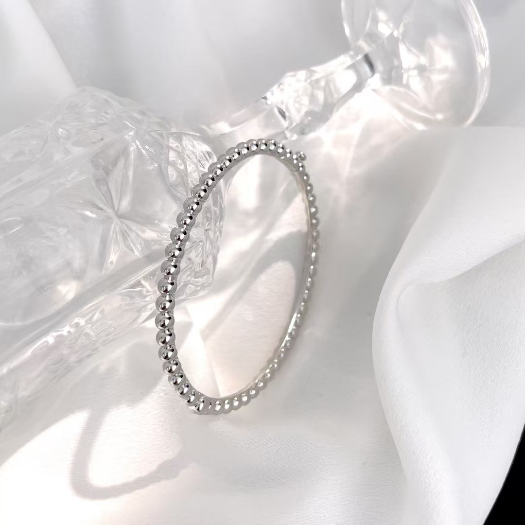 Buy replica Van Cleef & Arpels Perlée Pearls of Gold Bracelet - Medium Bangle and replica jewelry from PICKS Jewelry