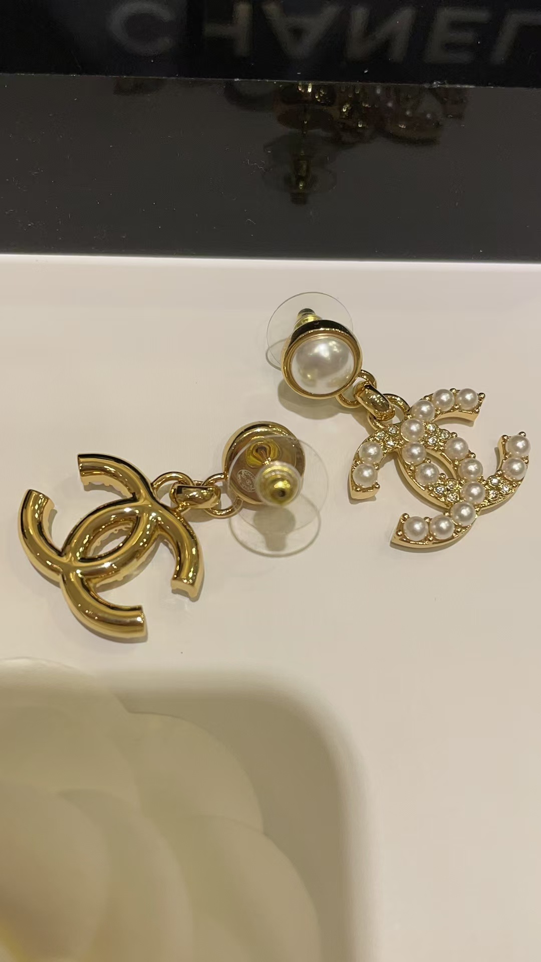 Buy replica Chanel Pearl Paved Double C Earrings and replica jewelry from PICKS Jewelry
