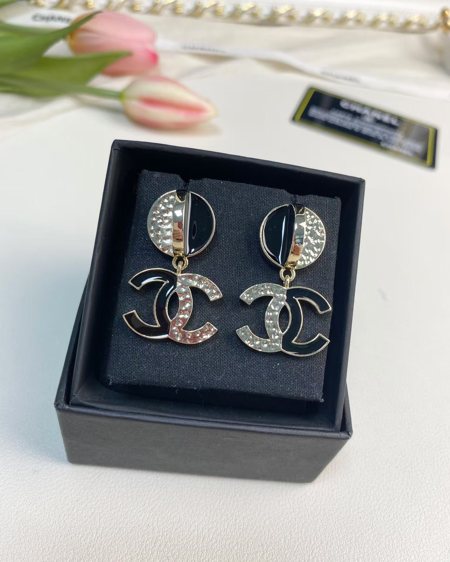 Buy replica Chanel Half Black Enamel Double C Dangle Earrings and replica jewelry from PICKS Jewelry