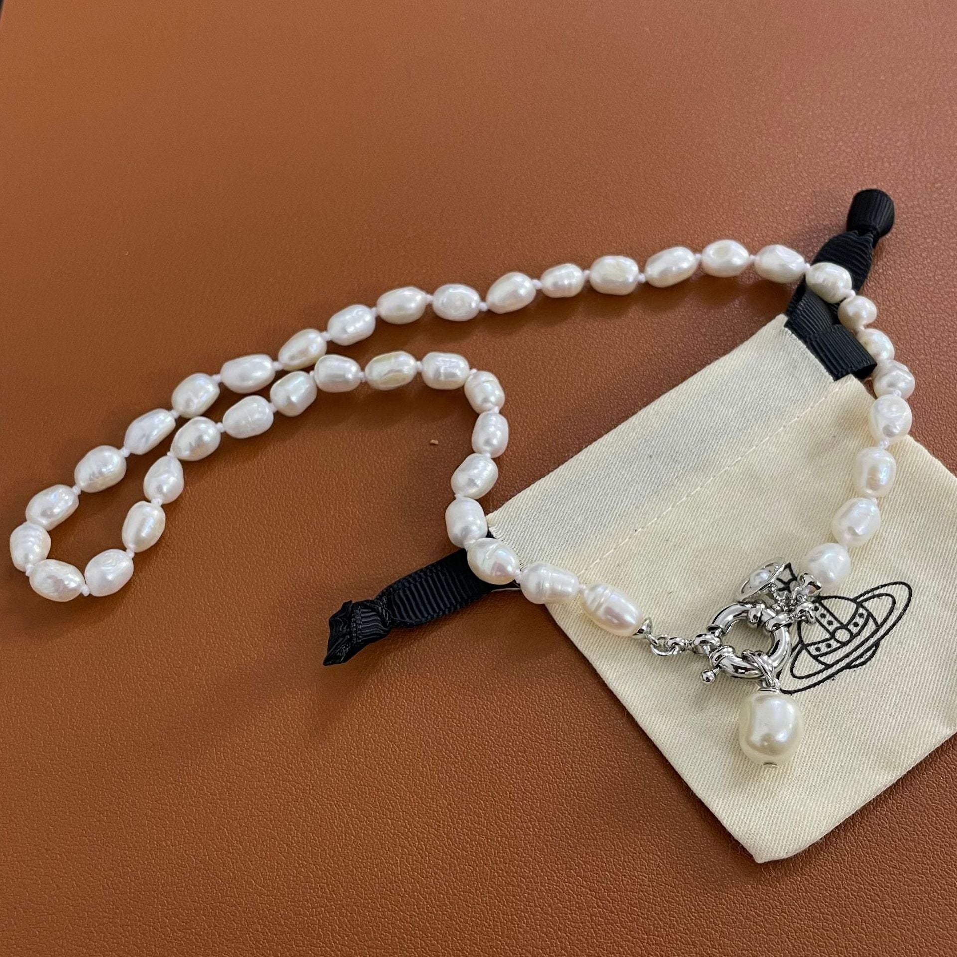 Buy replica Vivienne Westwood Teardrop Pearl Charm Pendant Necklace and replica jewelry from PICKS Jewelry