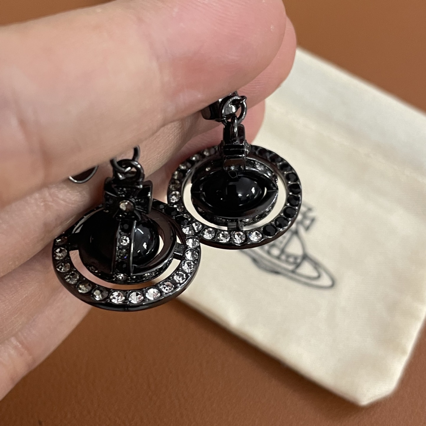 Buy replica Vivienne Westwood Punk Style Cool Girl Black Saturn Earrings and replica jewelry from PICKS Jewelry