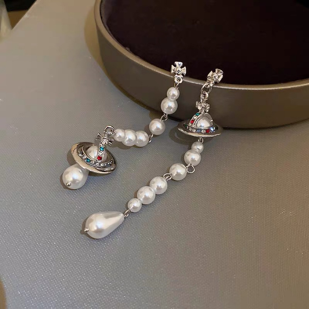 Buy replica Vivienne Westwood Asymmetric Tassel Pearl Saturn Earrings and replica jewelry from PICKS Jewelry