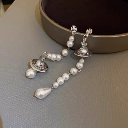 Buy replica Vivienne Westwood Asymmetric Tassel Pearl Saturn Earrings and replica jewelry from PICKS Jewelry