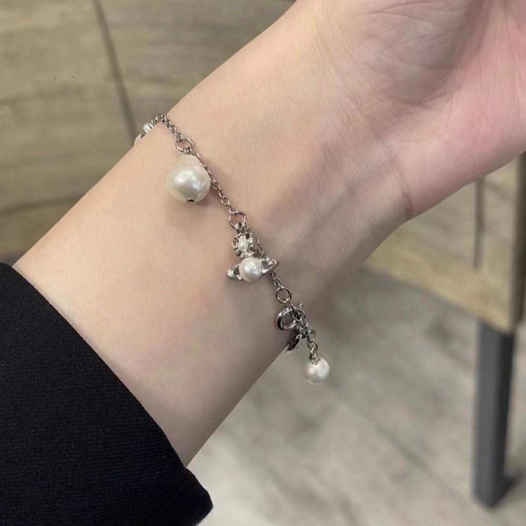 Buy replica Vivienne Westwood Baroque Pearl Saturn Charms Bracelet and replica jewelry from PICKS Jewelry