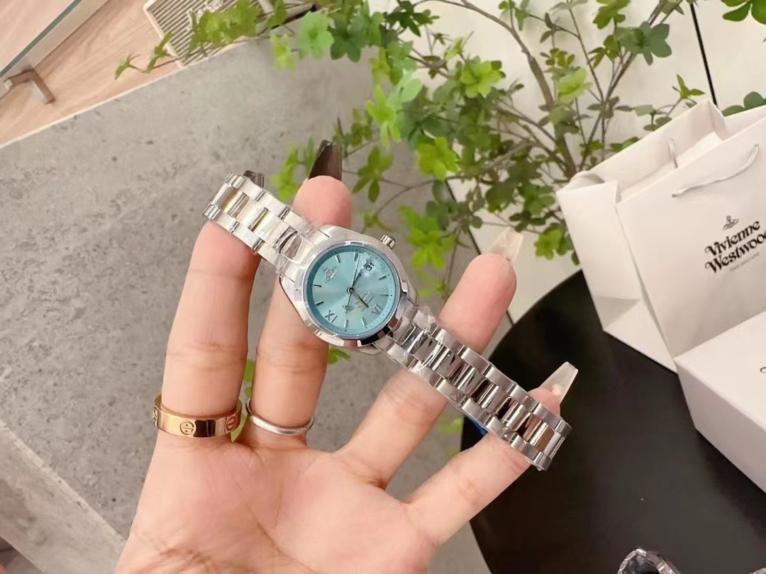 Buy replica Vivienne Westwood Light Blue Dial Silver Band Saturn Watch - 28MM and replica jewelry from PICKS Jewelry