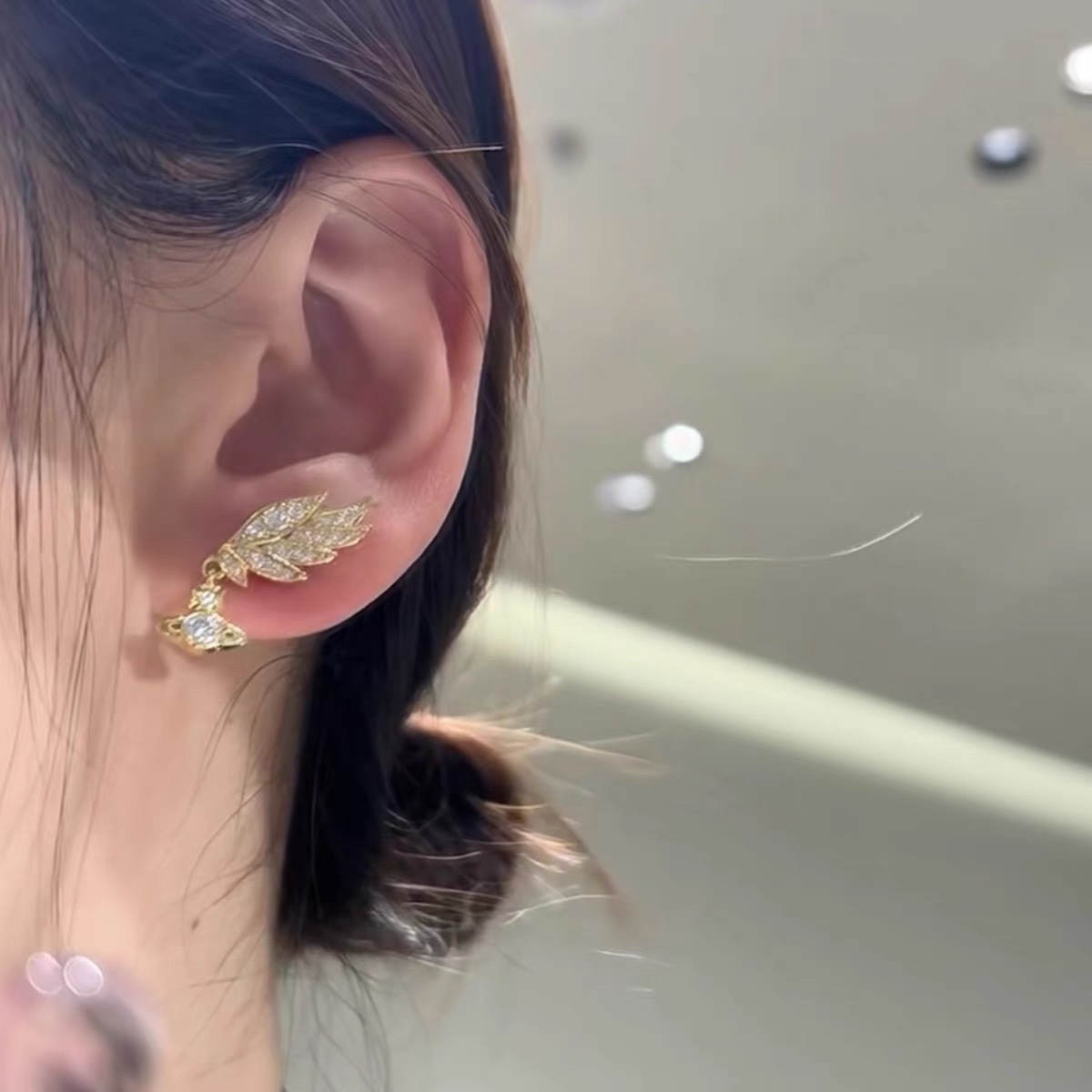 Buy replica Vivienne Westwood Angel Wing Saturn Earrings and replica jewelry from PICKS Jewelry