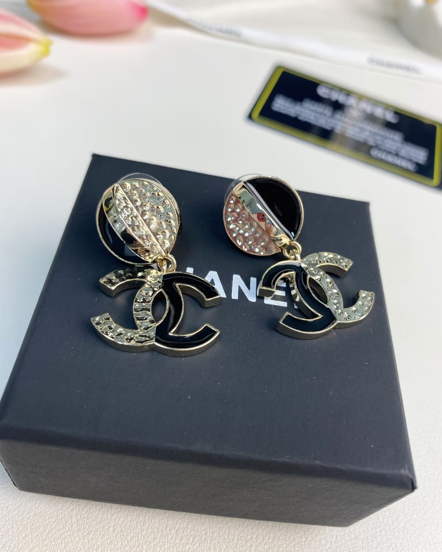 Buy replica Chanel Half Black Enamel Double C Dangle Earrings and replica jewelry from PICKS Jewelry