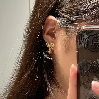 Buy replica Vivienne Westwood Bowknot Crystal Saturn Earrings and replica jewelry from PICKS Jewelry