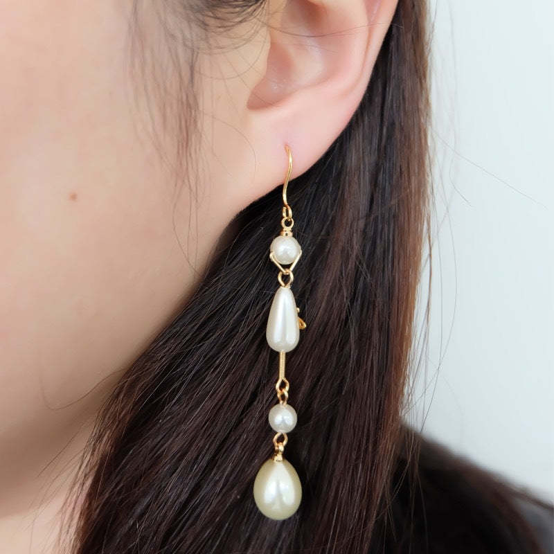 Buy replica Vivienne Westwood Teardrop Pearl Saturn Earrings and replica jewelry from PICKS Jewelry