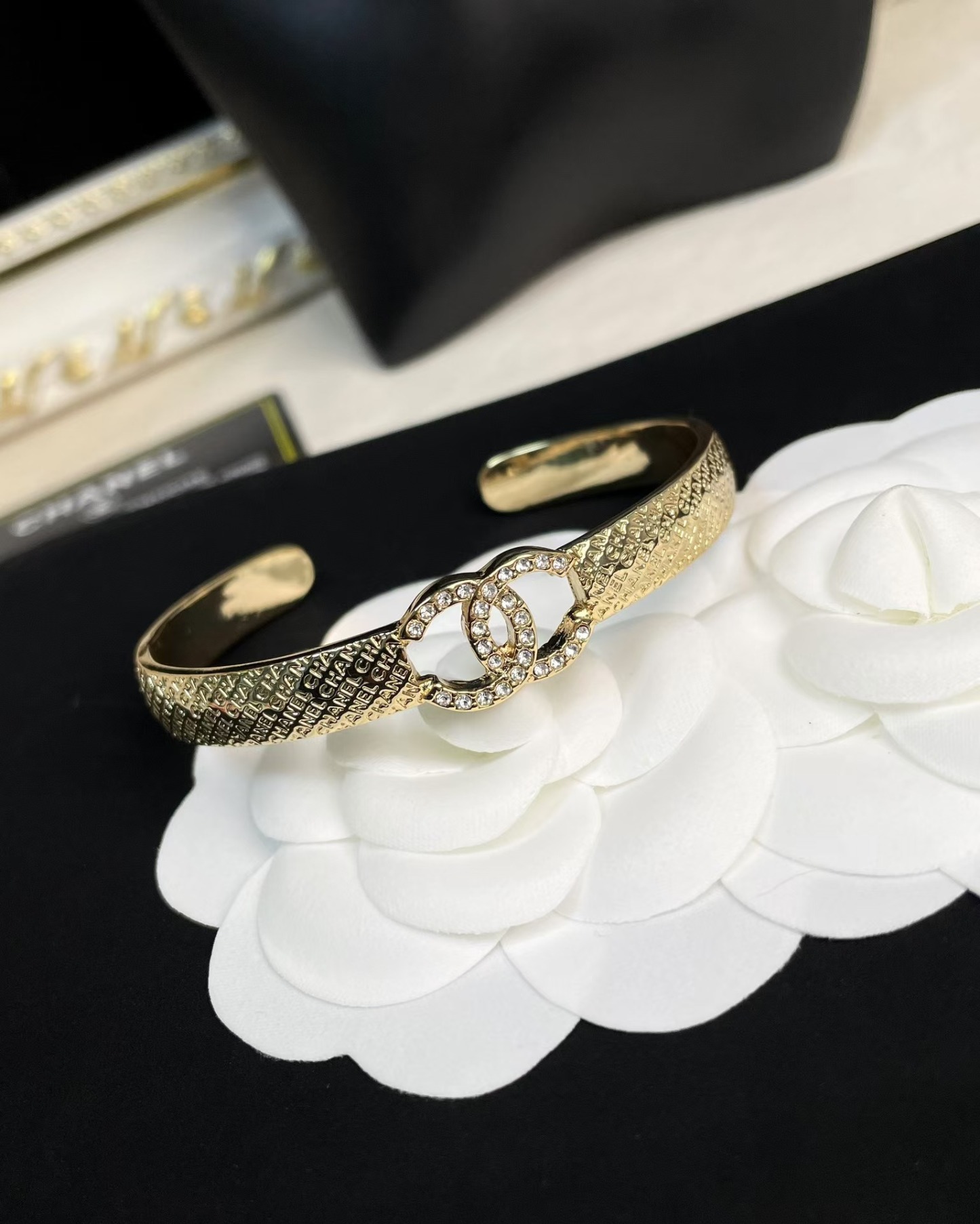 Buy replica Chanel Hollow Diamond Paved Double C Open Bangle Bracelet and replica jewelry from PICKS Jewelry