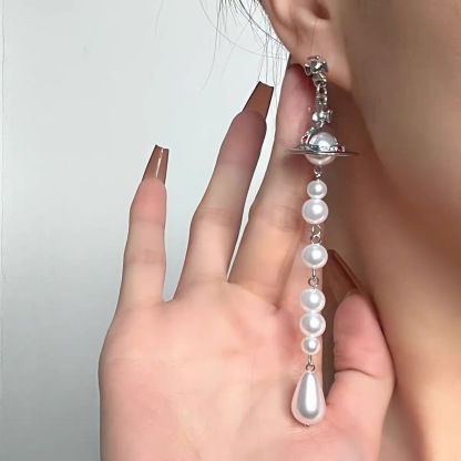 Buy replica Vivienne Westwood Asymmetric Tassel Pearl Saturn Earrings and replica jewelry from PICKS Jewelry