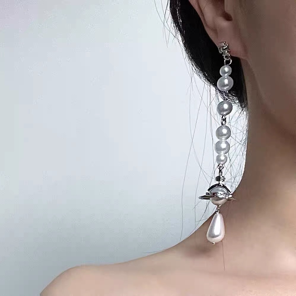 Buy replica Vivienne Westwood Asymmetric Tassel Pearl Saturn Earrings and replica jewelry from PICKS Jewelry