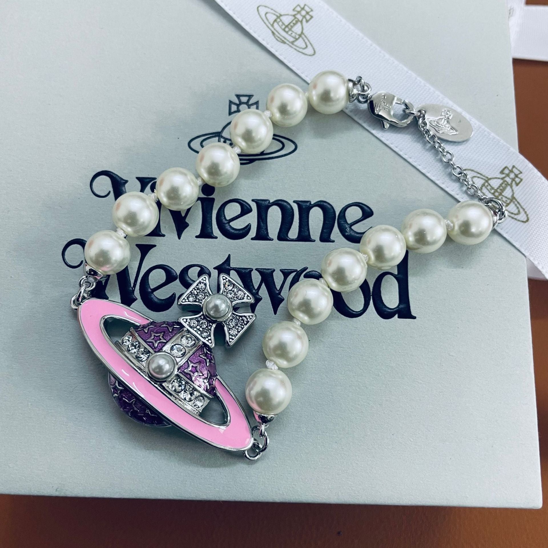 Buy replica Vivienne Westwood Enamel Diamond Saturn Bracelet and replica jewelry from PICKS Jewelry