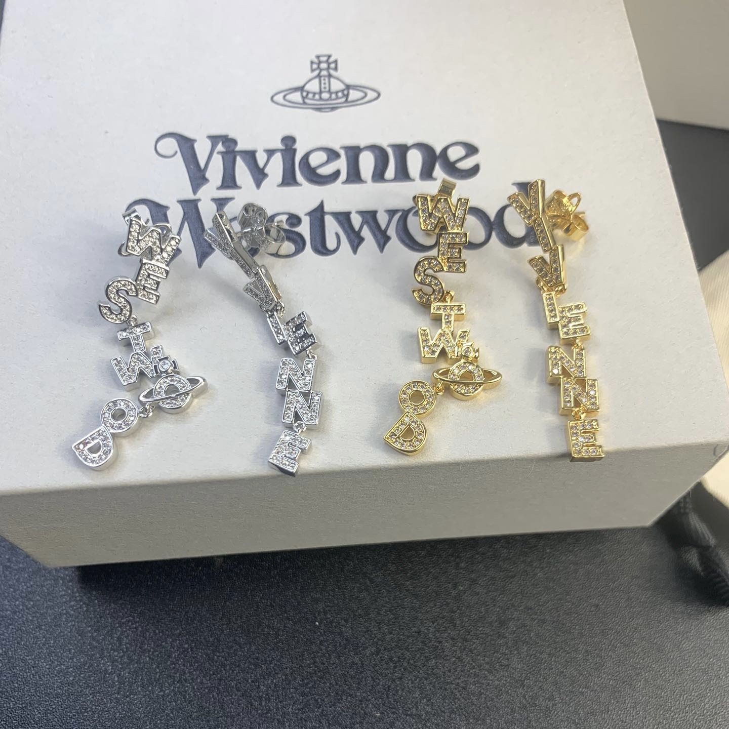 Buy replica Vivienne Westwood Letters Asymmetric Earrings and replica jewelry from PICKS Jewelry