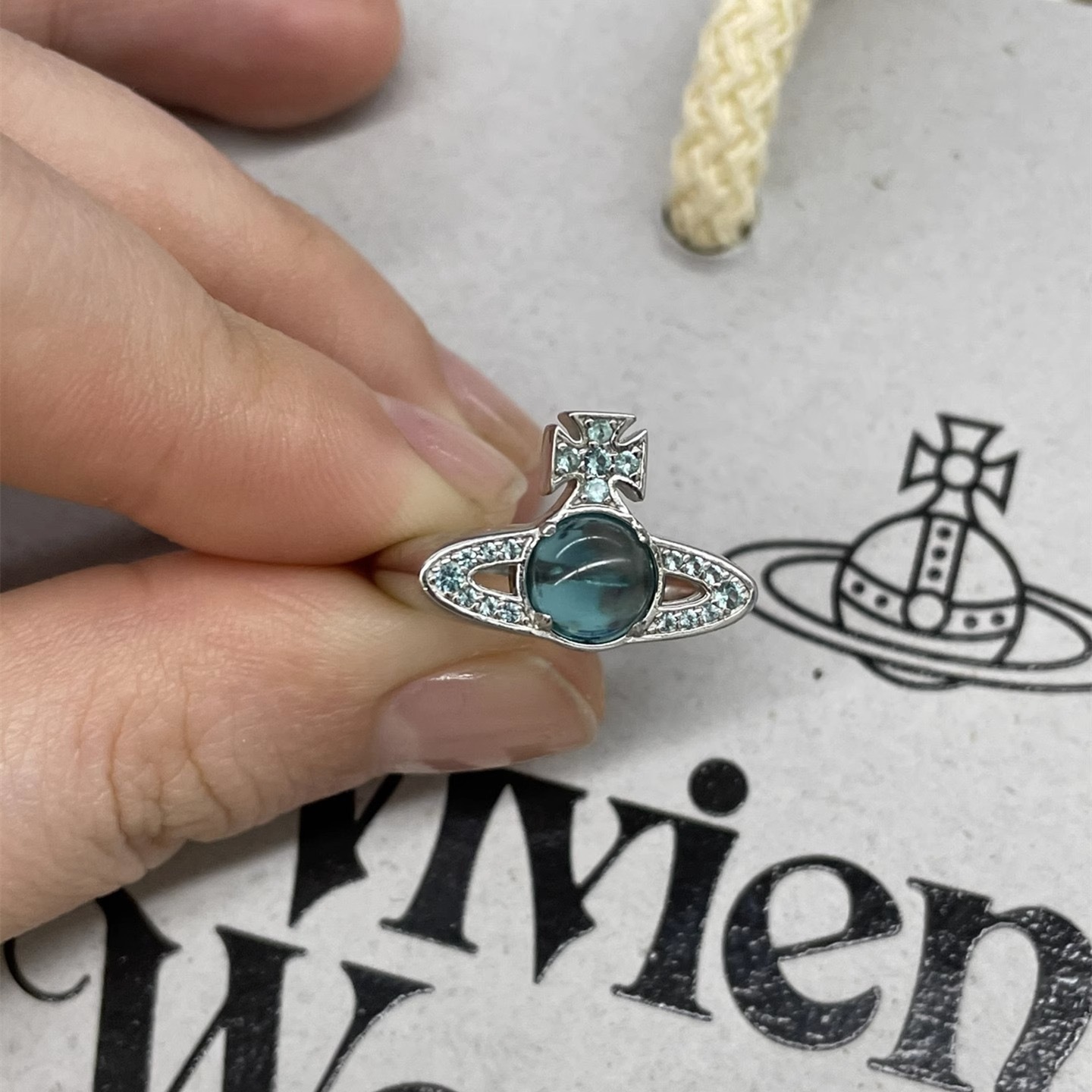 Buy replica Vivienne Westwood Lake Blue Lucky Bead Saturn Ring and replica jewelry from PICKS Jewelry