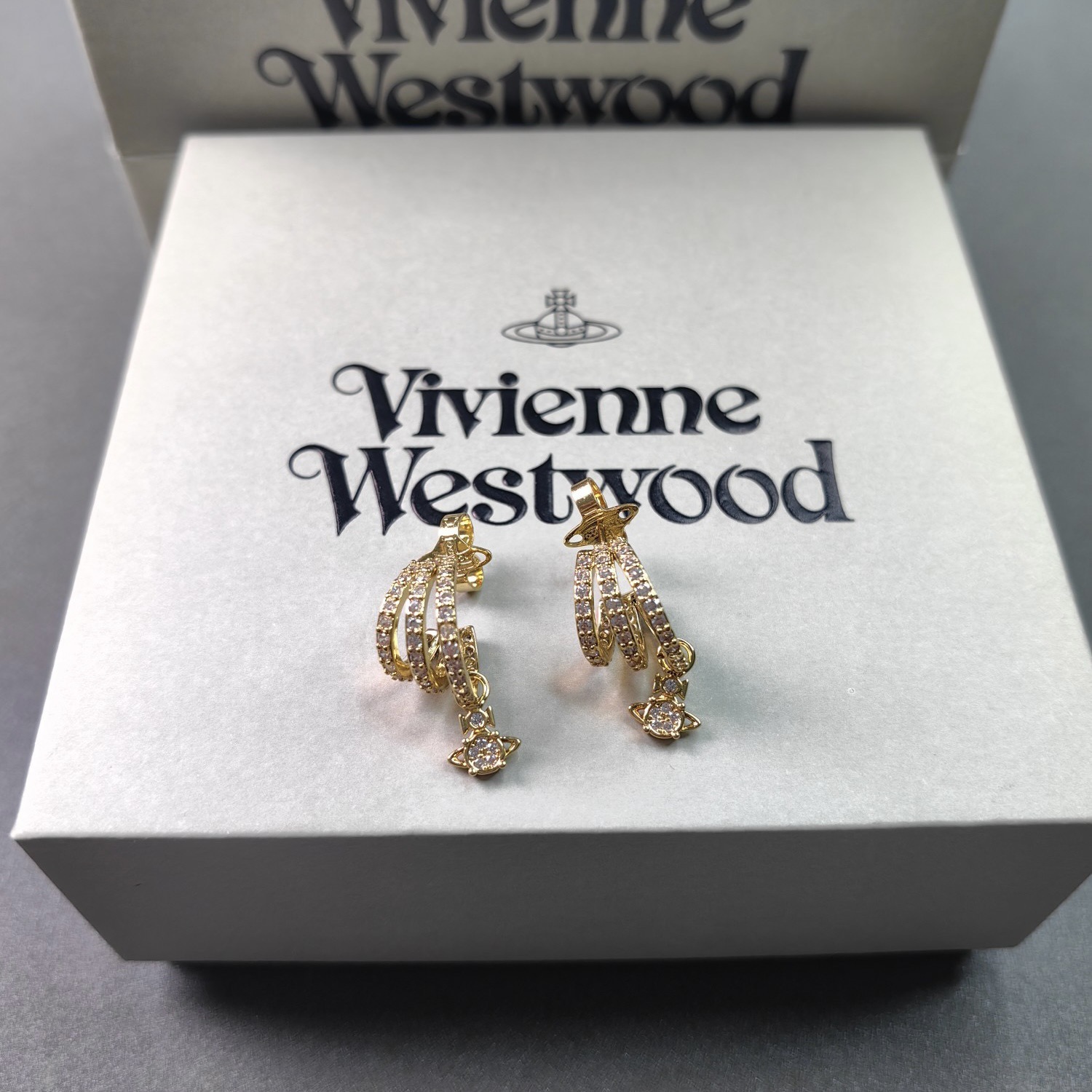 Buy replica Vivienne Westwood C Shape Saturn Drop Earrings and replica jewelry from PICKS Jewelry
