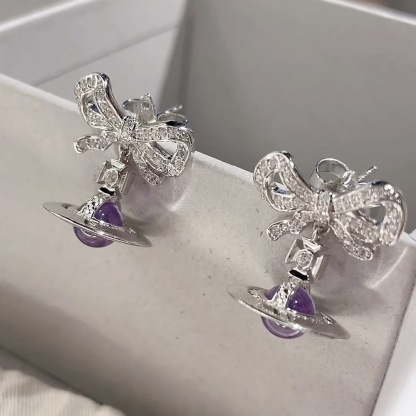 Buy replica Vivienne Westwood Bowknot Crystal Saturn Earrings and replica jewelry from PICKS Jewelry