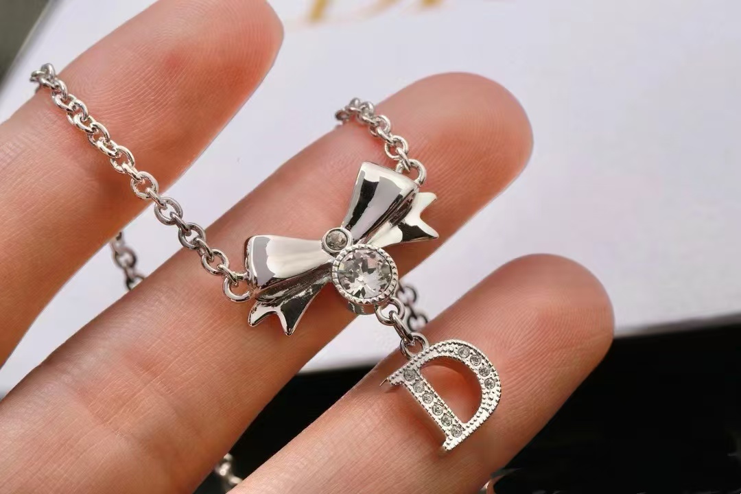 Buy replica Dior Bow Letter D Pendant Necklace and replica jewelry from PICKS Jewelry