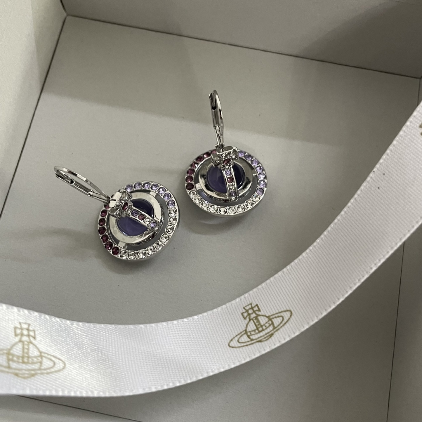 Buy replica Vivienne Westwood Light Purple Crystal Ball Planet Saturn Earrings and replica jewelry from PICKS Jewelry