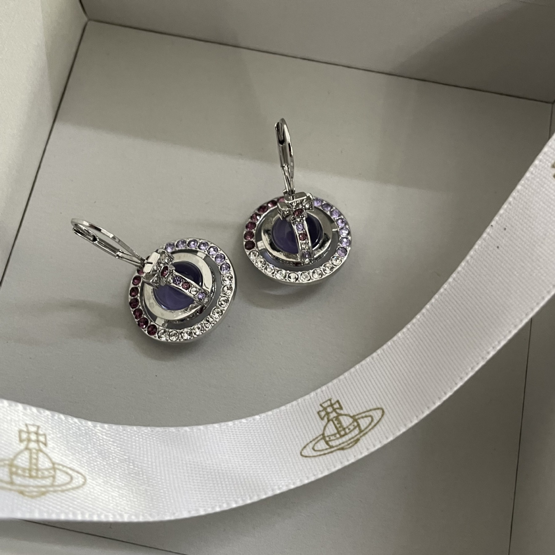 Buy replica Vivienne Westwood Light Purple Crystal Ball Planet Saturn Earrings and replica jewelry from PICKS Jewelry