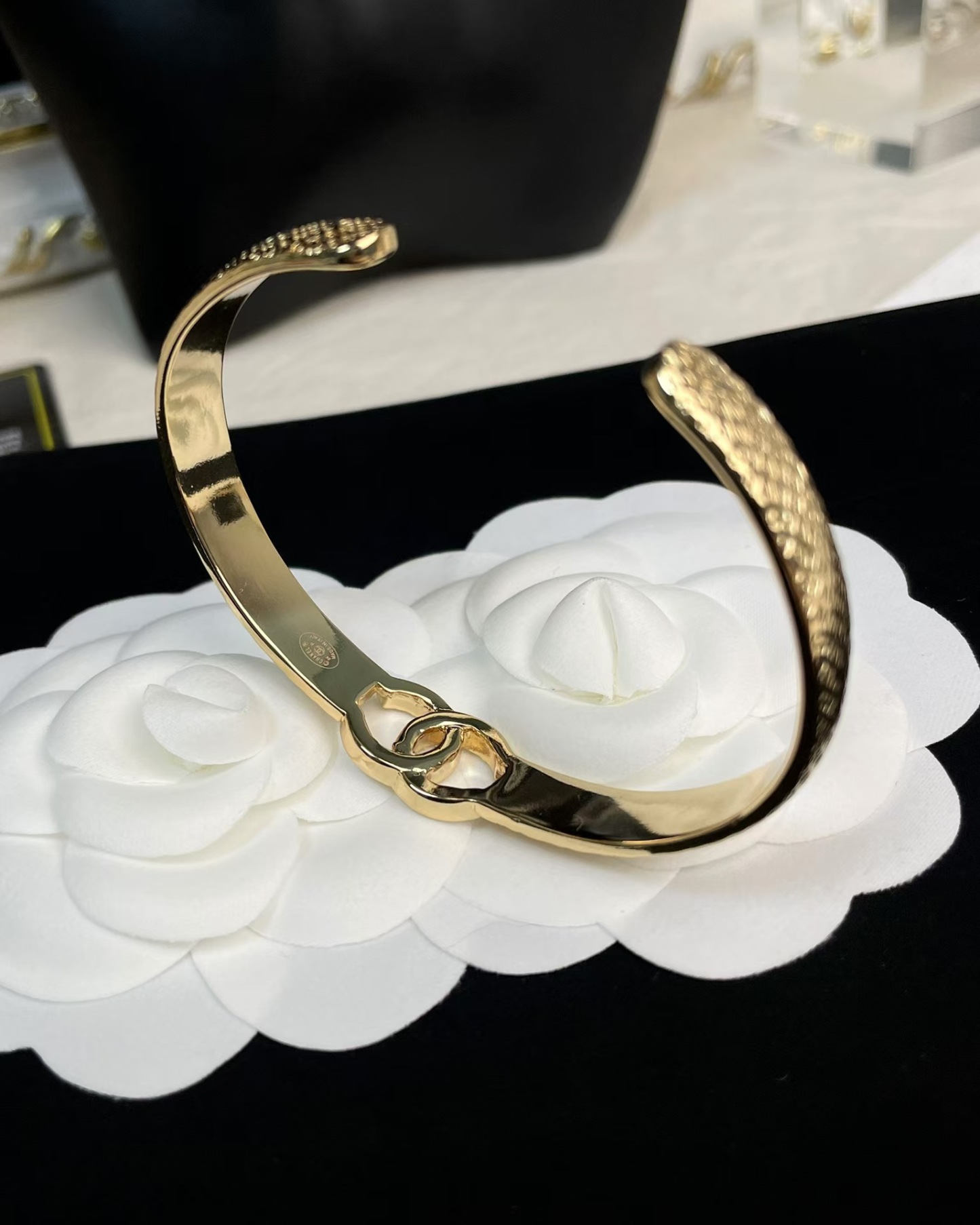 Buy replica Chanel Hollow Diamond Paved Double C Open Bangle Bracelet and replica jewelry from PICKS Jewelry