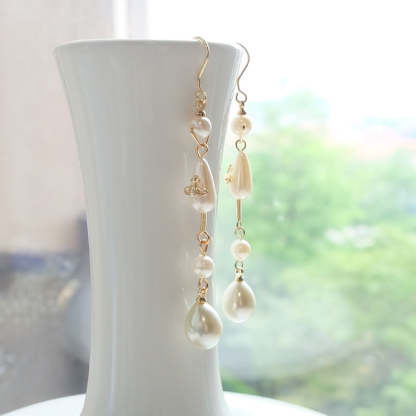 Buy replica Vivienne Westwood Teardrop Pearl Saturn Earrings and replica jewelry from PICKS Jewelry