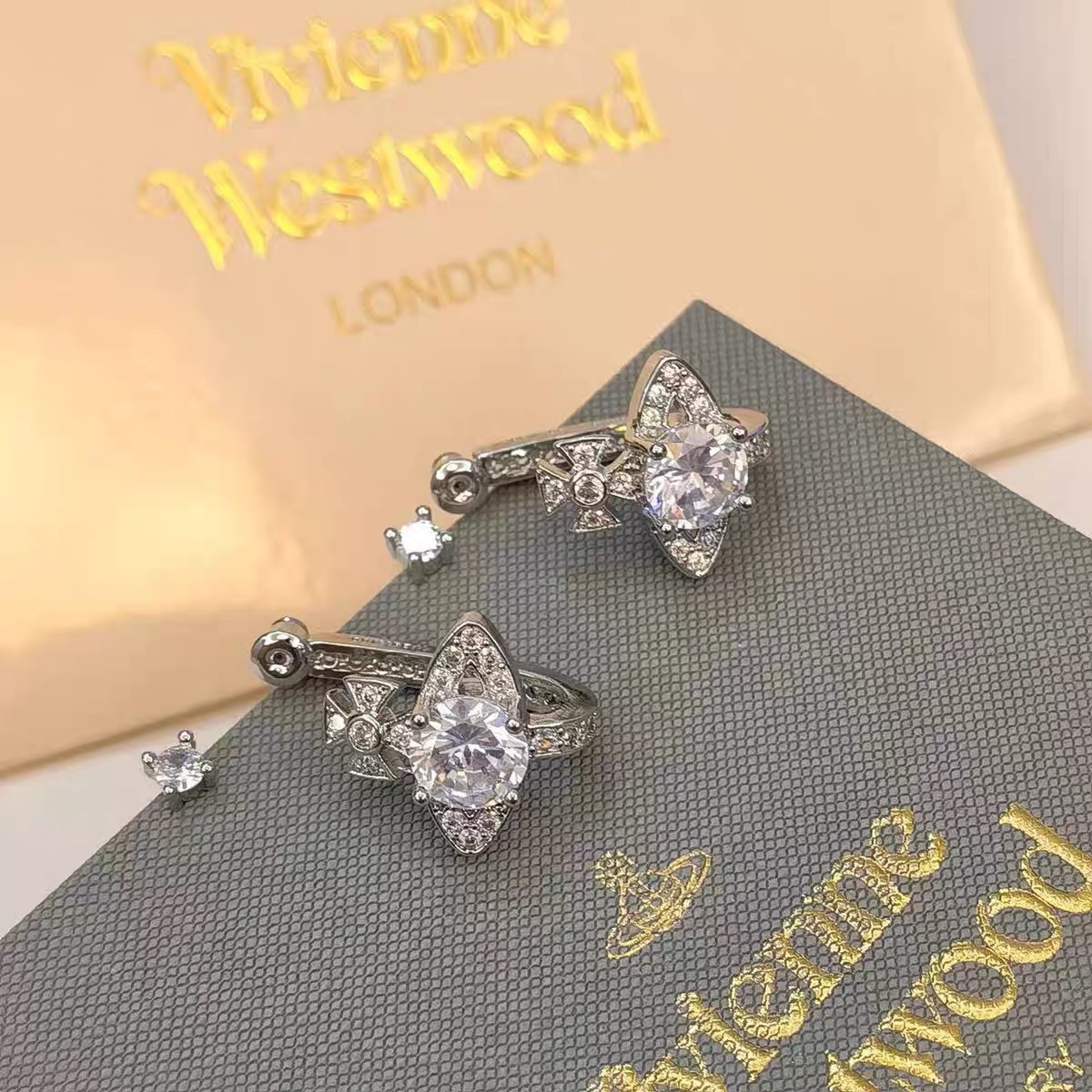 Buy replica Vivienne Westwood Pink White Diamond Saturn Earrings and replica jewelry from PICKS Jewelry