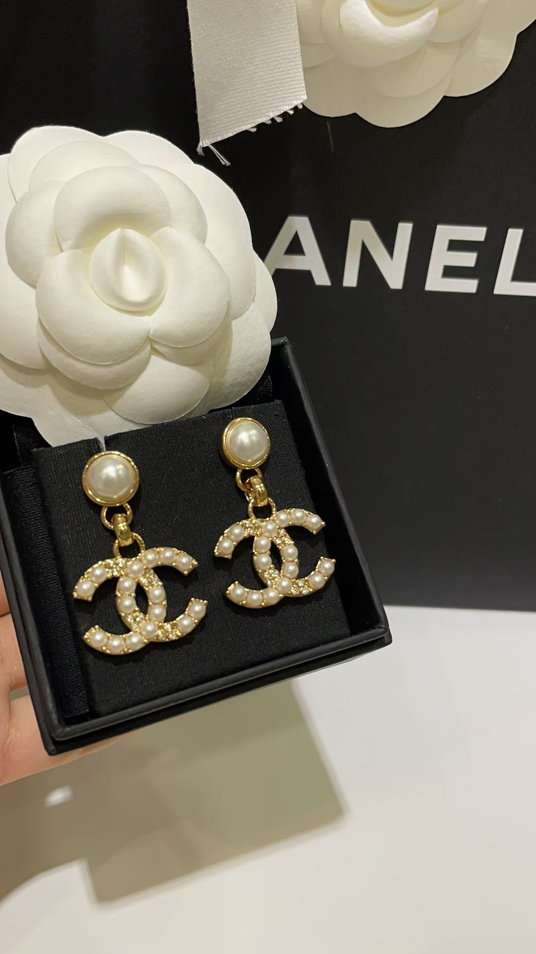 Buy replica Chanel Pearl Paved Double C Earrings and replica jewelry from PICKS Jewelry
