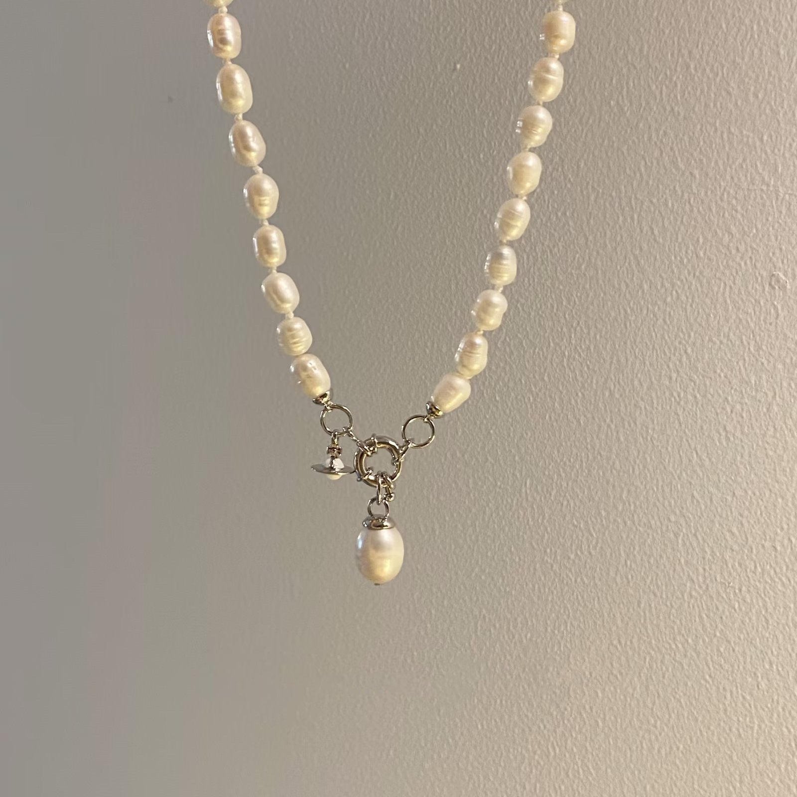 Buy replica Vivienne Westwood Teardrop Pearl Charm Pendant Necklace and replica jewelry from PICKS Jewelry