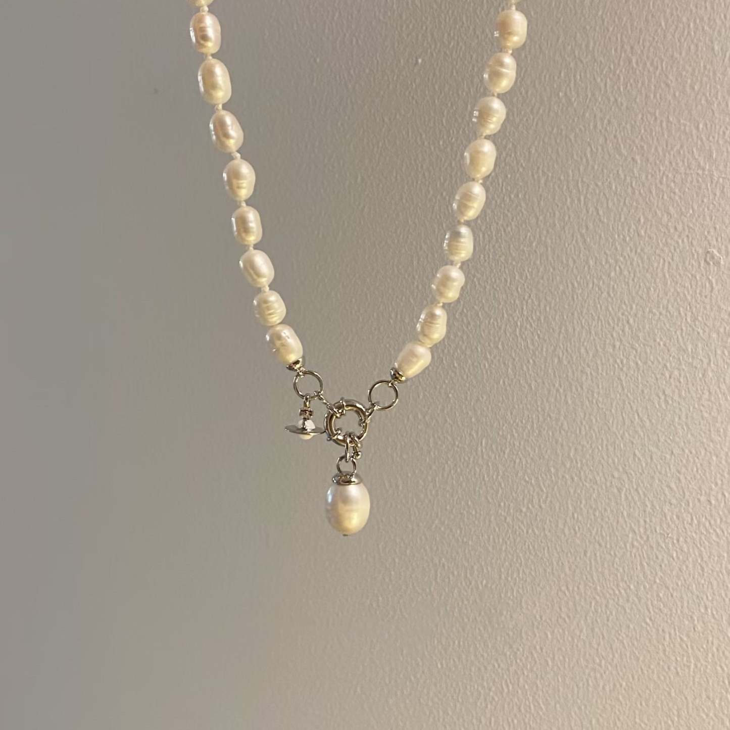 Buy replica Vivienne Westwood Teardrop Pearl Charm Pendant Necklace and replica jewelry from PICKS Jewelry