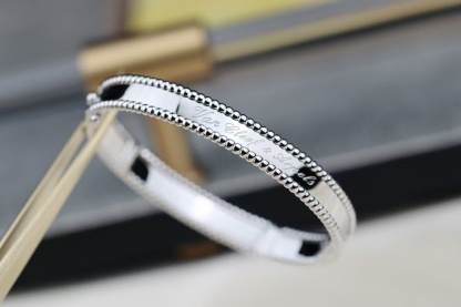 Buy replica Van Cleef & Arpels Perlée Signature Bracelet - Medium Bangle and replica jewelry from PICKS Jewelry