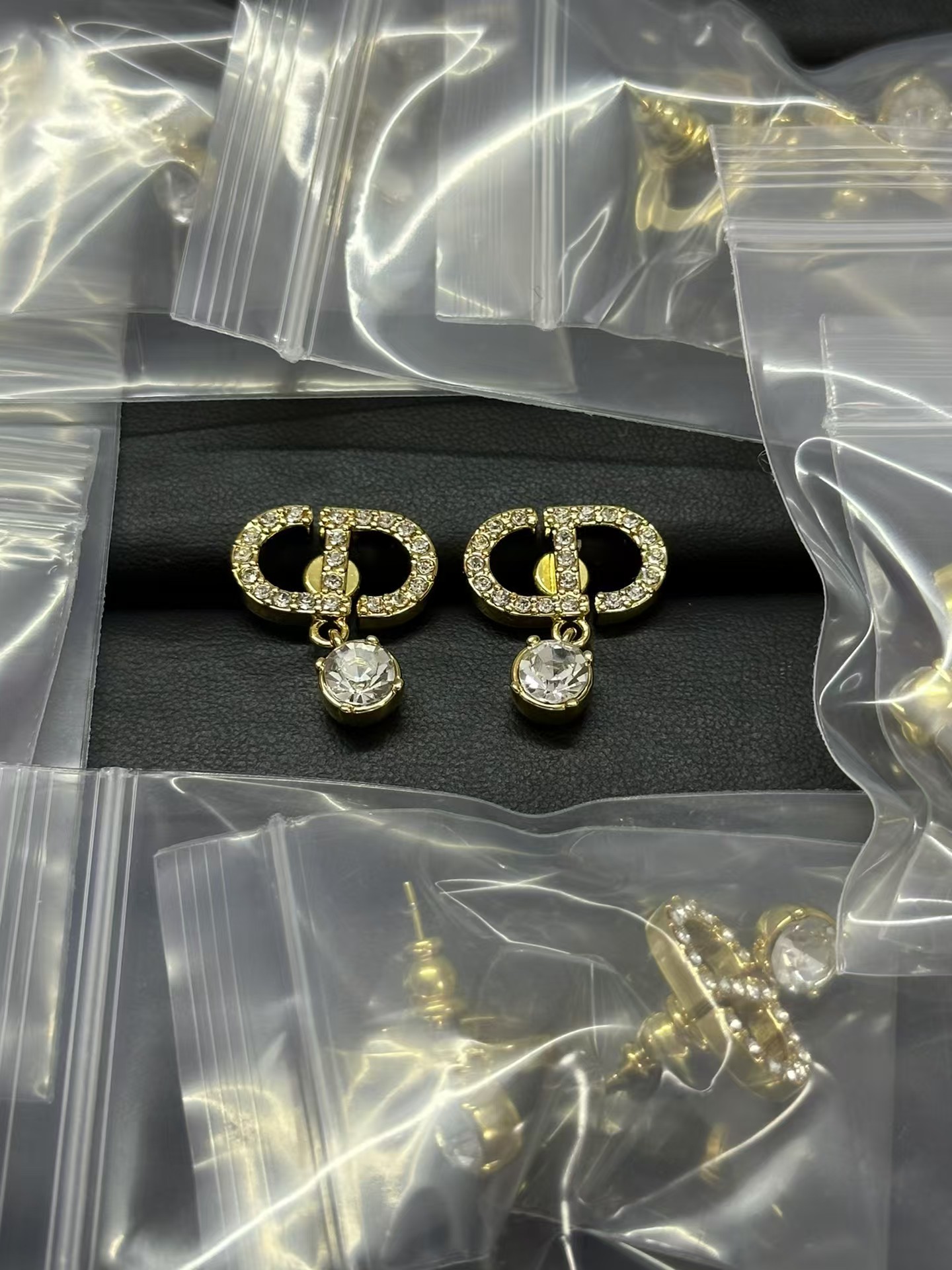 Buy replica Dior Diamond Paved CD Stud Earrings and replica jewelry from PICKS Jewelry