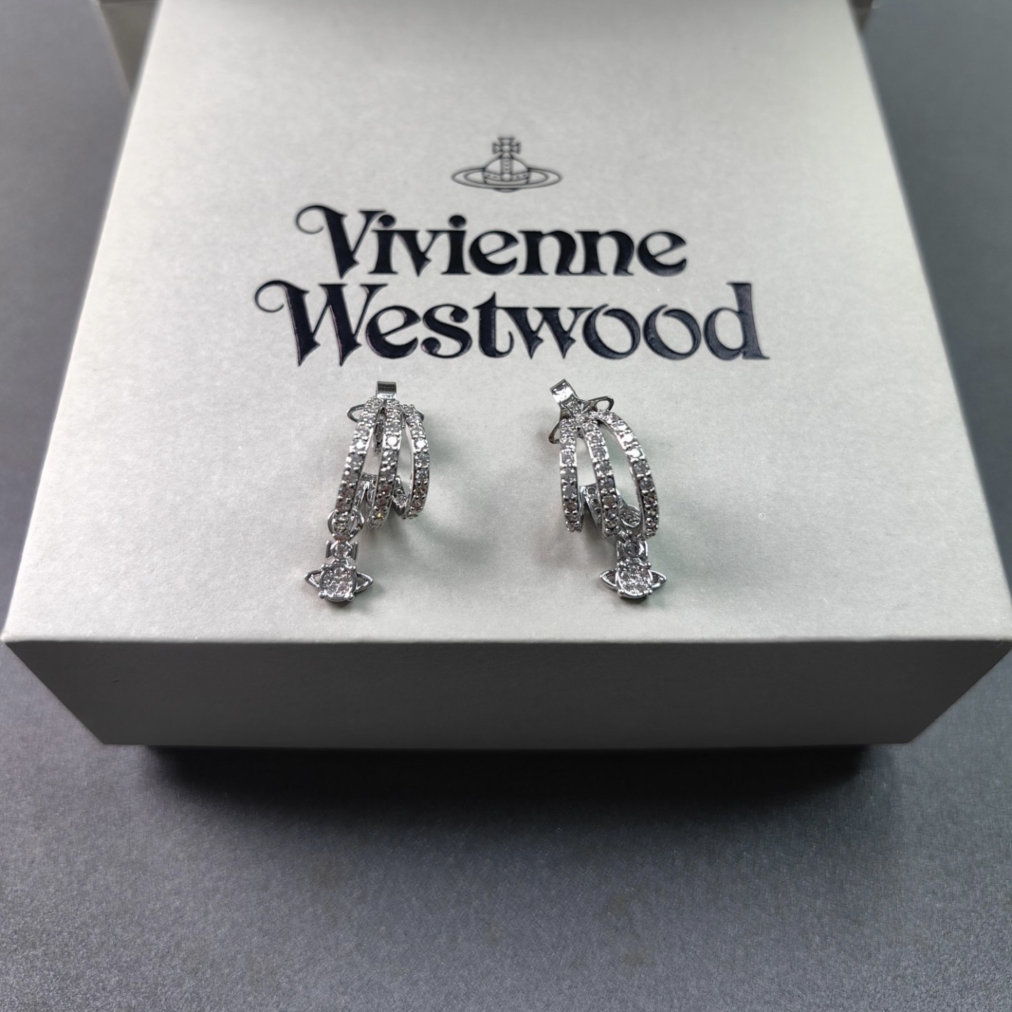 Buy replica Vivienne Westwood C Shape Saturn Drop Earrings and replica jewelry from PICKS Jewelry