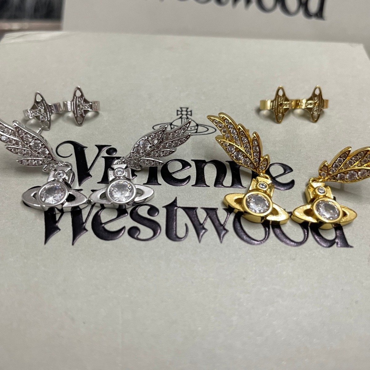 Buy replica Vivienne Westwood Angel Wing Saturn Earrings and replica jewelry from PICKS Jewelry